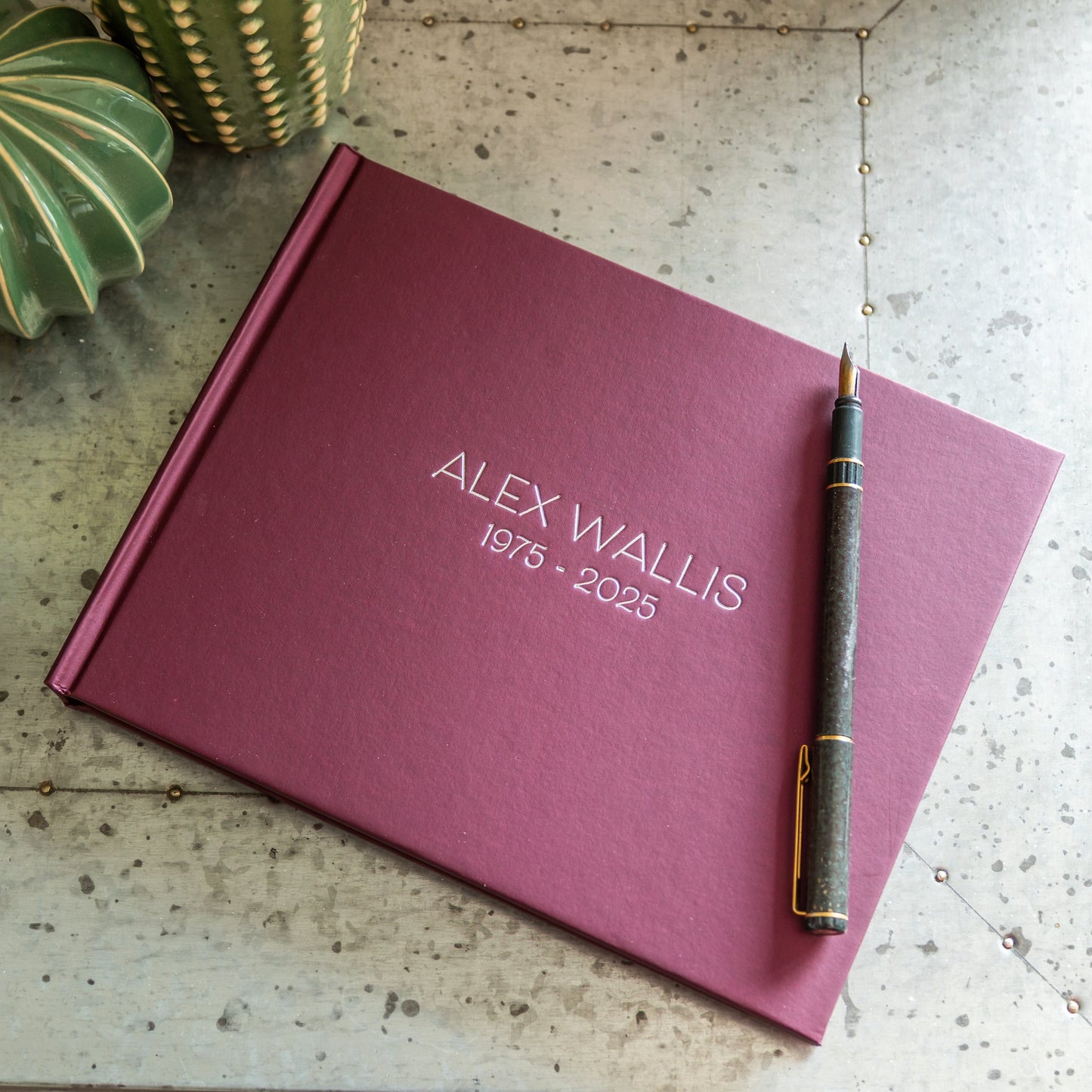 Hardback Condolence Book, embossed with 'Alex Wallis 1975 - 2025'