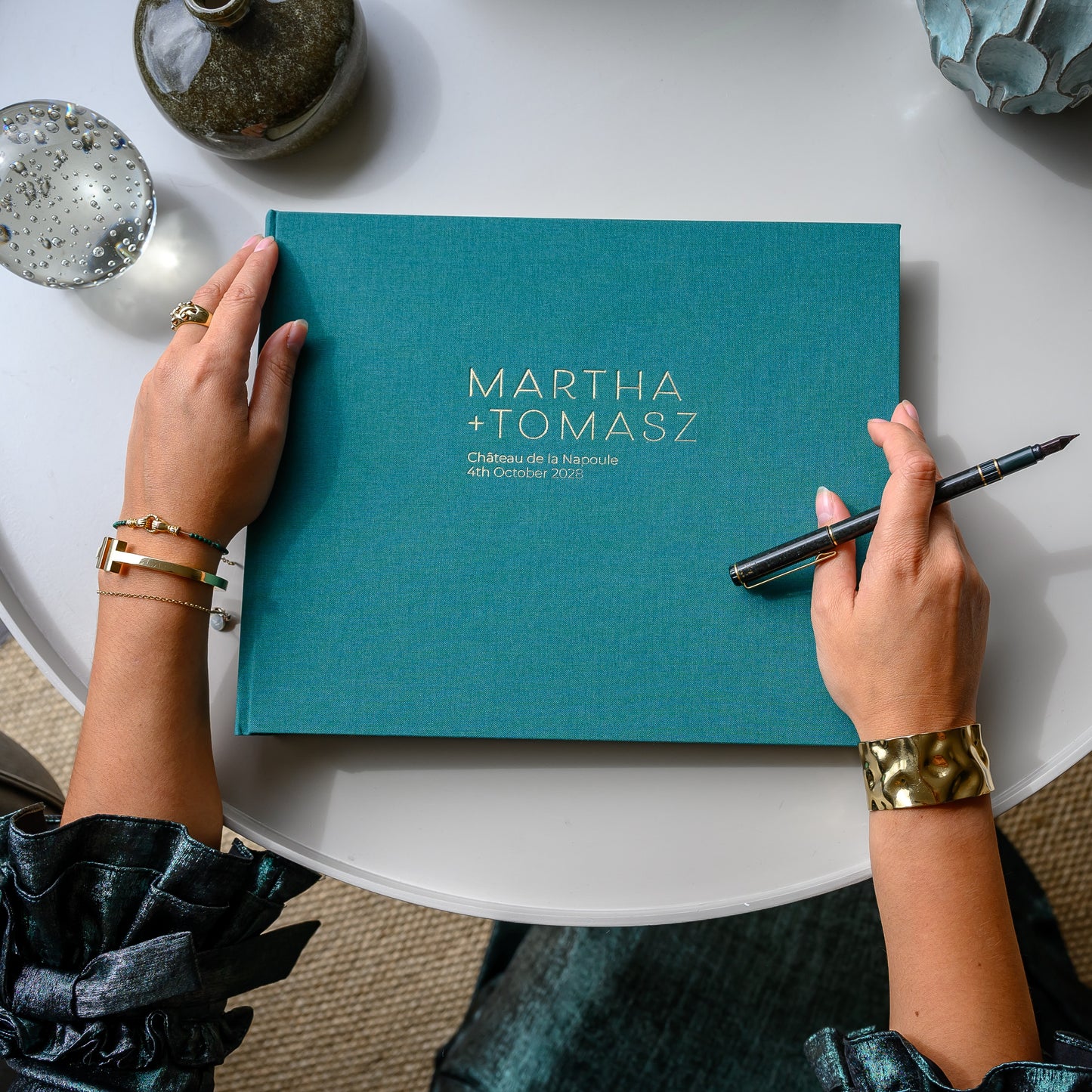Blue Photo Album printed with  'MATILDA 27 MARCH 2001' being held by a woman.