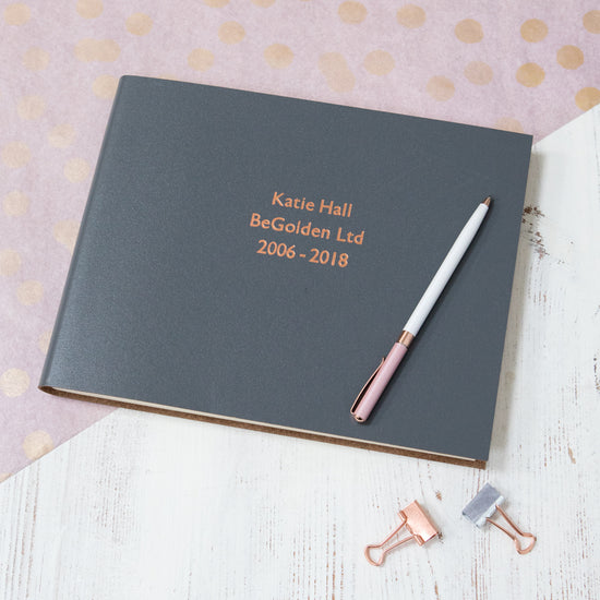 another example of the leather leavers book - this time it is a charcoal grey book that has been printed with rose gold foil