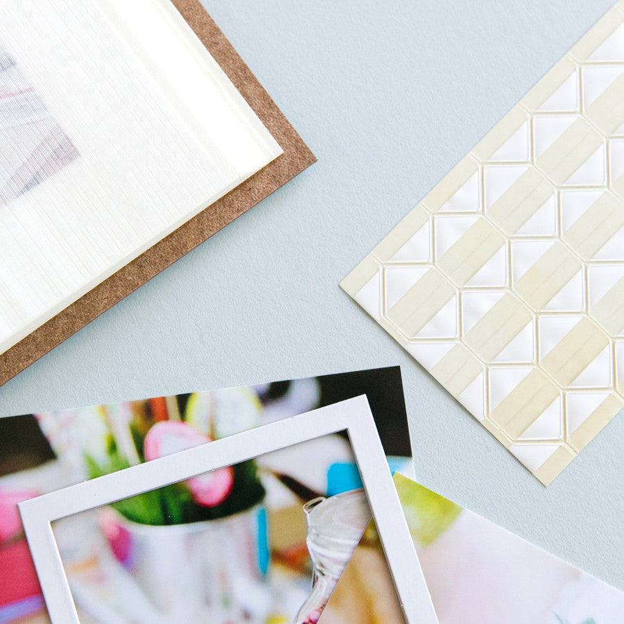 
                      
                        you can see mounting squares on the side of the table and then some photos showing you how you stick them into your photo album
                      
                    