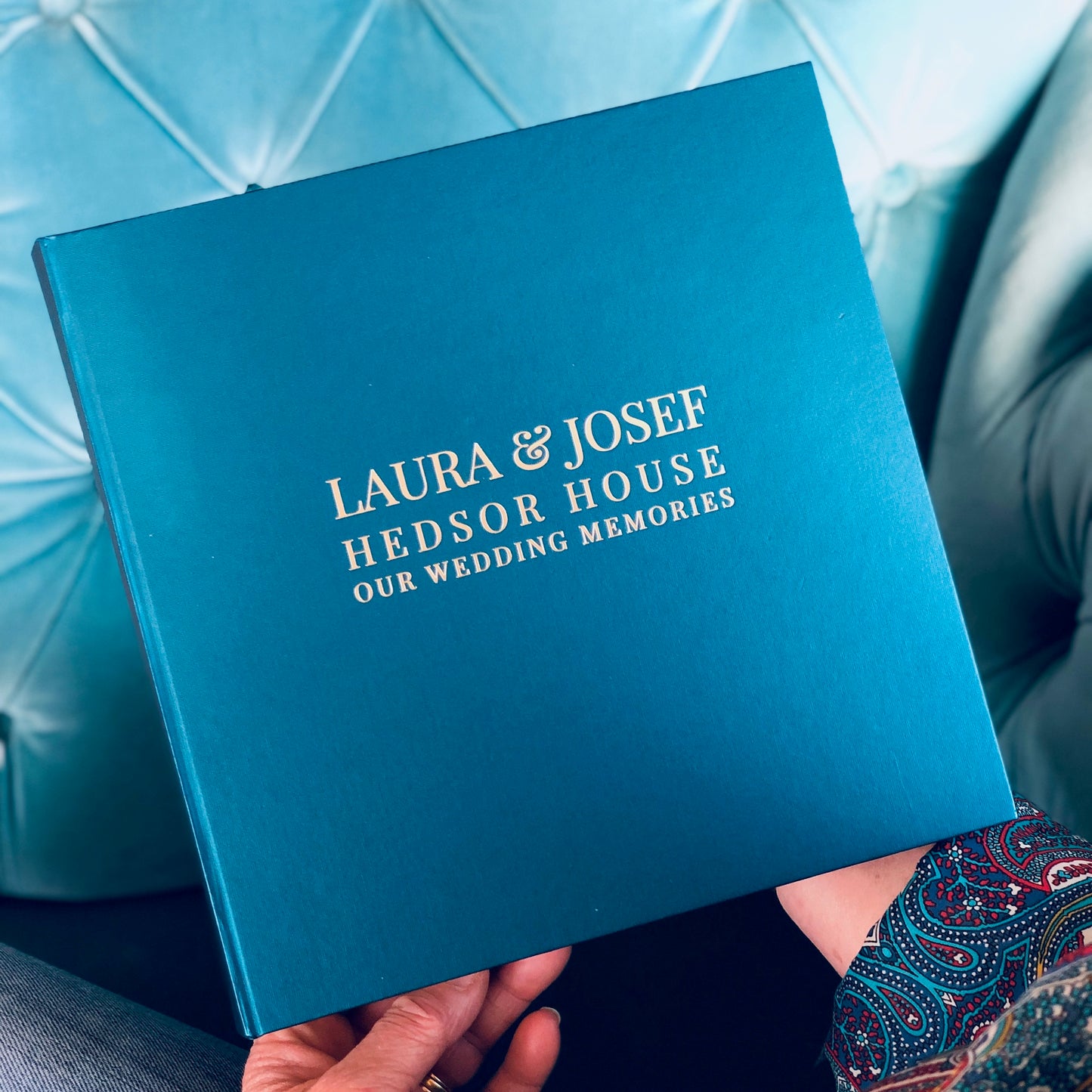 Gorgeous blue photo album filled with wedding memories and hand printed on the cover.