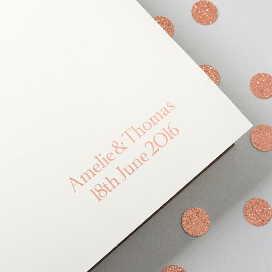 
                      
                        Large leather photo album with Amelie & Thomas written in the bottom right hand corner. 
                      
                    
